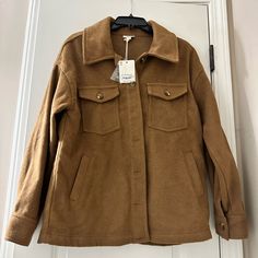 Camel Colored Shacket. Can Be Worn As A Jacket For A Trendy Look Or As A Shirt. It Is Heavy And Has Pockets. Quality Made. Brown Collared Utility Jacket For Fall, Brown Utility Jacket For Fall, Brown Utility Jacket With Button Closure For Fall, Brown Collared Shacket For Work, Brown Button-up Shacket For Work, Fall Collared Brown Shacket, Collared Brown Shacket For Fall, Fall Brown Collared Shacket, Brown Lapel Collar Shacket For Fall