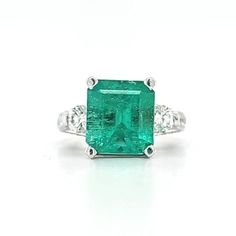 Circa 2000, a 14k white gold, emerald cut emerald and diamond ring, finger size 6.75. This ring features a natural Colombian 4.45cts square emerald cut emerald, measuring 10.72 x 9.94 x 6.67mm. 2 round brilliant cut diamonds total 0.60ctw, these diamonds are H/I color SI2 clarity. Plus an additional 46 round full cut diamonds totaling an estimated 1.04ctw, these diamonds are also H/I color SI2/I1 clarity. Weight is 8.6 grams. Stamped 14k, and hallmarked LLJ. Condition is very good. Thanks for looking. ERA - Circa 2000, Vintage METAL / MATERIAL - 14k white gold MARKINGS / HISTORY - Stamped 14k, and hallmarked LLJ CONDITION - The overall condition is very good! A true representation of 2000s-era jewelry! SIZE / MEASUREMENTS -Size 6.75 / natural Colombian 4.45cts square emerald cut emerald, m 2000s Era, Emerald And Diamond Ring, Ring Finger, Metal Material, Round Brilliant Cut Diamond, Antique Items, Emerald Cut, Rings Statement, Vintage Metal