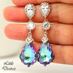 "These gorgeous and timeless Swarovski Vitrail Light Earrings have a Victorian touch of elegance and romance. The baroque pendants have classic scroll-shaped silhouettes and are precision beveled/faceted to enhance the color and characteristic of the crystal, making each piece a glistening treasure! Perfect for brides, bridesmaids and special occasions! Earrings made with: - 22mm GENUINE Swarovski Vitrail Light Baroque crystals. The crystals emit so much shine and sparkle as it changes colors at Elegant Lavender Earrings For Party, Elegant Purple Clip-on Earrings, Elegant Lavender Crystal Earrings For Party, Purple Pear-shaped Earrings For Anniversary, Lavender Drop Earrings For Formal Occasions, Lavender Dangle Earrings For Formal Occasion, Purple Clip-on Jewelry For Gift, Purple Clip-on Jewelry For Gifts, Purple Clip-on Jewelry As A Gift