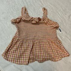 Nwt Old Navy Checkered Plaid Sleeveless Tank With Ruffle Straps Size- Large Color- Orange/Salmon/Cream Style- Plaid Print Tank Top With Smocked Body And Ruffle Straps. Slight Peplum Or Babydoll Waist. Material- 55% Cotton, 45% Rayon/Viscose Smoke/Pet Free Home!! Questions, Just Ask! Fast Shipping! Fall, Summer, Spring, Vacation, Plaid, Stripes, Babydoll. Trendy Sleeveless Smocked Top For Spring, Casual Spring Tank Top With Smocked Back, Spring Sleeveless Tank Top With Smocked Back, Summer Smocked Top With Ruffled Straps For Spring, Trendy Sleeveless Smocked Top, Trendy Summer Sleeveless Smocked Top, Pink Smocked Back Top For Summer, Casual Smocked Top With Ruffled Straps For Summer, Trendy Sleeveless Smocked Top For Day Out