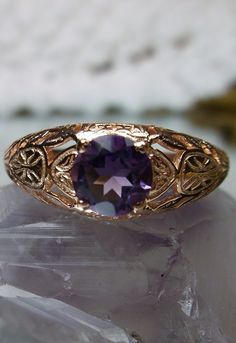 Natural Purple Amethyst Gold Ring Etched Wedding Design#160 Custom This stunning Victorian vintage reproduction ring in 10k rose gold has a brilliant natural purple amethyst gemstone. This full cut round cut genuine amethyst is 6mm in diameter. The inside of the band is marked 10k for gold. Notice the beautiful floral design of the gold filigree setting. This is a lovely rendition of an Antique filigree wedding ring. Make a spectacular statement about love and romance with this glorious solitair Filigree Wedding Ring, Vintage Wedding Jewelry, Antique Filigree, Amethyst Gold, Luxury Rings, Amethyst Gem, Purple Band, Sterling Silver Filigree, Filigree Ring