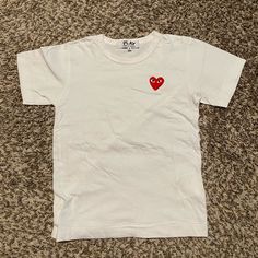 Item: Comme Des Garcons Play Classic Red Heart T-Shirt White Size: Small (Fits Like A Women's Xs) Condition: Brand New Without Tags. Included: Not Included: Shipping: All Items Will Be Shipped Within 24-48 Hours After Payment Has Been Confirmed. White Cotton T-shirt With Heart Patch, Trendy Short Sleeve Tops With Heart Patch, White Short Sleeve Tops With Heart Print, Casual Crew Neck T-shirt With Heart Patch, Casual Cotton T-shirt With Heart Patch, Casual Short Sleeve Tops With Heart Patch, Short Sleeve Tops With Heart Patch, Red Crew Neck Top With Heart Graphic, Red Crew Neck Top With Heart Patch