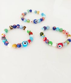 ⭐️The millefiori beads on the stretch bracelets are made of glass. ⭐️These Italian Floral beaded bracelets include multicolored Millefiori beads with glass evil eye. ⭐️This Millefiori Stretch Bracelet with Evil eye charm would be the perfect gift as a protection amulet. For more evil eye bracelets, click the link below; https://www.etsy.com/shop/EyeDesignsbyGG?ref=search_shop_redirect&section_id=30219689 Multicolor 8mm Beaded Wristband, Multicolor 8mm Beads Evil Eye Bracelet, Adjustable Multicolor Evil Eye Beads, Multicolor Evil Eye Bracelet With Colorful Round Beads, Adjustable Multicolor Evil Eye Bracelet With 8mm Beads, Multicolor Beaded Bracelets With Evil Eye, Spiritual Multicolor Beaded Bracelets With Evil Eye, Multicolor Beaded Evil Eye Bracelet Spiritual, Multicolor Beaded Evil Eye Bracelet