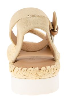 Beautifully woven raffia lends tropical style to a vacation-ready sandal boasting PORON® cushioning for all-day comfort. 1 1/4" heel, 3 1/2" shaft (size 8.5) Adjustable ankle strap with buckle closure Multilayered, PORON-cushioned footbed with arch support Textile upper/leather lining/rubber sole Imported Casual Beige Braided Sandals, Woven Leather Sandals For Summer, Natural Straw Sandals With Removable Insole, Casual Braided Sandals In Natural Color, Beige Braided Sandals For Spring, Spring Beige Braided Sandals, Spring Vacation Sandals With Woven Leather, Summer Vacation Wedge Sandals With Adjustable Strap, Beige Ankle Strap Sandals For Vacation