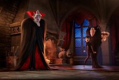 the animated characters are dressed up in black and red robes, standing on a stage