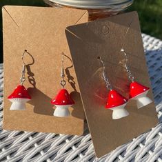 Bigger mushroom charm earrings  Comes in the color red  Light weight and comfortable  Handmade .  Great gift for a groovy friend Cute Handmade Mushroom-shaped Earrings, Cute Mushroom-shaped Earrings For Gifts, Cute Handmade Mushroom Earrings, Handmade Cute Mushroom Earrings, Mushroom Design Dangle Earrings For Gift, Mushroom Design Dangle Earrings As Gift, White Mushroom Design Earrings For Gift, White Mushroom Design Earrings As Gift, Playful Red Dangle Jewelry