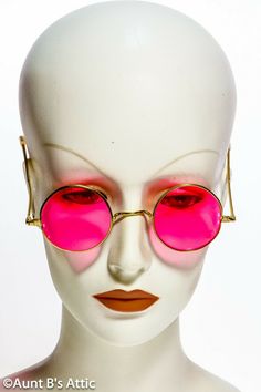 60's "Lennon" style, "Rose Colored" costume glasses. Gold metal frame, with rose tinted plastic lens. No U.V. protection. Fun accessory for any retro 60's costume. Vintage Round Frame Sunglasses For Party, Gold Round Frame Sunglasses For Party, Gold Round Frame Party Sunglasses, Pink Sunglasses With Mirrored Lenses And Round Frame, Pink Round Frame Sunglasses With Mirrored Lenses, Vintage Pink Sunglasses With Uv Protection, Retro Pink Adjustable Sunglasses, Vintage Pink Sunglasses For Party, Vintage Pink Sunglasses With Mirrored Lenses