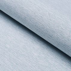 a close up shot of a light blue fabric