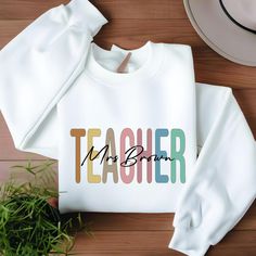 Custom Teacher Sweatshirt Shirt, Teacher Mrs Sweatshirt, Teacher Appreciation gift, Gift for Teacher, Retro Teacher shirt We are trying to use always the highest quality brands like Bella Canvas and Gildan when they are available. Therefore the blend can slightly change due to stock levels. How to Order a T-Shirt: Review all the photos carefully. Choose your T-shirt color. Select your size. Click "Add to Cart." You can return to add more colors or complete your purchase. Click "Proceed to Checkout." Your custom shirt will be ready to ship within 1-3 business days. For bundle purchases, note that the price shown is for one item. To buy a bundle of two, place two separate orders. After purchasing, please message us with details about the print. Product Details: Side seams, retail fit Shoulde Teacher Sweatshirt Ideas, Sweatshirt Ideas, Mrs Sweatshirt, Teacher Sweatshirt, Teacher Appreciation Gift, Gift For Teacher, Custom Shirt, Teacher Appreciation Gifts, Teacher Shirts