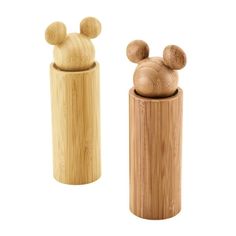 two wooden salt and pepper shakers with mickey mouse heads on the top one is made out of bamboo