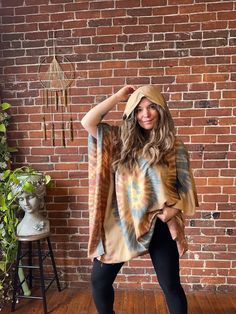 Stay cool and covered in Tie Dye with the Free Size Spiral Poncho Hoodie! Made of flowy rayon, this hoodie features armholes for a comfortable fit up to size 3X. Perfect for any boho festival or casual day out. Bust up to 55" around Arm circumference up to: 21" 30" long shoulder to hem 100% rayon hand wash gently, Air Dry Please take a moment to look over all shop policies before purchasing. Casual Hooded Poncho For Summer, Casual Hooded Poncho For Festival, Bohemian Hooded Top For Summer, Bohemian Hooded Top For Fall, Casual One Size Poncho For Loungewear, Casual Poncho For Spring Loungewear, Casual Spring Poncho For Loungewear, Casual Hooded Poncho For Spring, Casual Hooded Spring Poncho