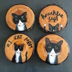 four wood slices with cats painted on them and the words cat mom written in black