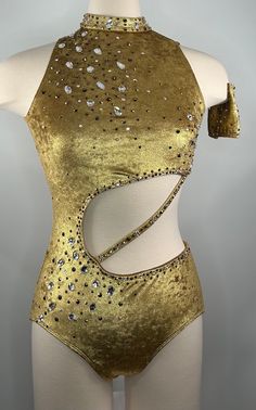 a gold bodysuit with sequins on the back and side cutouts, worn by a mannequin