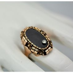 This is part of Chairish’s Fine Jewelry assortment.  Black Onyx Ring with Diamond 14K Rose Gold  This black onyx ring is set in 14K rose gold. It has a small Diamond set on the top. This ring is from the 1940's and is highly detailed and chase worked, just look at the sides and mount. It is substantial and weighs 9.7 grams. It is 3 cm long and 2 cm wide and a depth of 2.34cm size 10. This is a basic ring for many and this Black Onyx ring with Diamond should be in your collection. Comes out of th Antique Black Rings With Rose Cut Diamonds, Vintage Rose Gold Diamond Ring With Gemstone, Victorian 14k Gold Rings With Black Enamel, Victorian Black Enamel 14k Gold Rings, Vintage Black Rings With Rose Cut Diamonds, Vintage Oval Rose Gold Ring, Vintage 14k Rose Gold Rings In Gold Color, Vintage 14k Rose Gold Rings For Formal Occasions, Vintage Onyx Ring For Formal Occasions