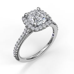 a cushion cut diamond halo engagement ring