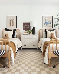 two twin beds with teddy bears on them in a bedroom