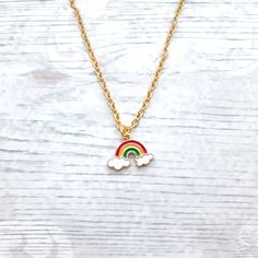 Super cute enamel rainbow charm necklace perfect for any rainbow lover. Great little birthday for family or friends. Would go perfect with matching items which can be found in my store. CHAIN LENGTH: *14inches perfect for children  *16inches perfect for children *18inches *20inches *22inches MARTERIALS: Chain, findings and charms and all gold plated *The enamel rainbow charm measures approximately 2cms long. * green, yellow, red * red, yellow, purple *These can also be personalised with initial charms which can be picked from the menu. The initial charms are gold plated and measure 1cm. ☆☆The necklace comes presented in a gift bag but boxes and gift wrapping can also be purchased from my store.☆☆ If you have any questions or custom orders please feel free to message me. Iris Cabin, Fairytale Bracelet, Boyfriend Initials, Initial Birthstone Necklace, April Birthstone Necklace, Unicorn Bracelet, Pride Necklace, Crescent Moon Jewelry, March Birthstone Necklace