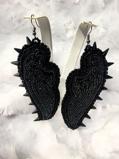 These OOOK black angel/fairy earrings represent strength, mystery and boldness. My angel wings are first machine embroidered and then hand beaded with selective seed beads. The combination of these two mediums results in a truly unique design just for you.  Through the process of machine embroidery, the vinyl becomes tattered but this only adds to the realistic path of life that beauty and strength prevails! I created this design from my inner inspiration and it gives me joy to release them to the one they are divinely made for. These are very lightweight and measure 3 1/2 inches long. Jingle Dress Dancer, Wing Angel, Jingle Dress, Path Of Life, Fairy Earrings, Dark Wings, Machine Embroidery Thread, Black Angel, Black Angels