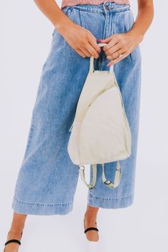 Carry all your essentials in style with the FREE PEOPLE - Soho Convertible Bag. This leather tote bag is the perfect versatile accessory for any outfit, giving you both practicality and fashion in one. Stay organized and effortlessly chic with this must-have bag. Casual Leather Backpack For On-the-go, Versatile Beige Hobo Bag For Daily Use, Versatile Everyday Hobo Bag With Zipper Pocket, Versatile Spring Hobo Bag For On-the-go, Versatile Beige Hobo Bag With Leather Handles, Spring Travel Backpack Shoulder Bag, Trendy Softback Hobo Bag For Everyday Use, Beige Hobo Bag For Travel, Versatile Summer Shoulder Bag For On-the-go