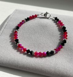 Bright and beautiful hot pink and jet black Swarovski/Preciosa crystal bracelet with .925 sterling silver accents and lobster clasp. This bracelet is stunning and has a brilliant sparkle- especially in the sun or in any kind of light. This specific bracelet measures at approximately 7" (see last photo) and is ready to ship. If you need a custom size, just message me! All of my bracelets are handmade with love by me! Thank you for looking and supporting my small business! Handmade Bracelet, Crystal Bracelet, Sterling Silver Bracelet, Silver Accents, Pink And Black, Crystal Bracelets, Jet Black, Handmade Bracelets, Sterling Silver Bracelets