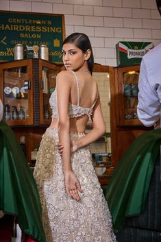 This lehenga set features all over three-dimensional embroidery in thread, pearl and sequin. The blouse is fully embroidered with a plunging neckline and shows pearl droplets at the waist. It is paired with a matching embroidered net dupatta.From Seema Gujral's For the love of London collection. DELIVERY TIMEPlease allow 8-12 weeks for your outfit to arrive. FABRIC DETAILSNet Professional cleaning only. Glamorous Pearl Embroidery Sets For Reception, Glamorous Pre-draped Saree With Pearl Embroidery, Glamorous Pre-draped Saree With Pearl Embroidery For Festive Occasions, Glamorous Festive Pre-draped Saree With Pearl Embroidery, Glamorous Designer Sharara With Pearl Embroidery, Glamorous Organza Sets With Pearl Embroidery, Festive Glamorous Choli With Pearl Embroidery, Glamorous Floor-length Sharara With Pearl Embroidery, Glamorous Lehenga With Pearl Embroidery For Party