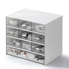 a white drawer with many drawers on it