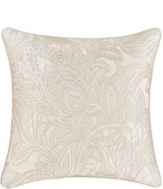 a white pillow with an intricate design on the front and back of it's cover