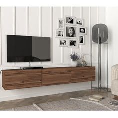 a living room with white walls and black furniture