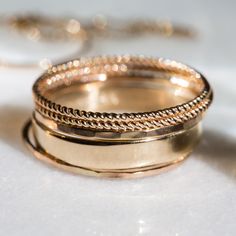 Hand-twisted stackers that look great on any finger. Add a beautiful bit of simple sparkle to your everyday look! Made in our Brooklyn studio with 100% recycled solid 14k gold. Thick Stackable Bands For Promise Ring, Double Band Stackable Promise Rings, Stackable Double Band Rings For Gifts, Stackable Adjustable Rings With Thick Band, Double Band Stackable Everyday Bands, Everyday Double Band Stackable Bands, Stacked Round Promise Rings, Fine Jewelry With Stackable Thick Band, Fine Jewelry Stackable Gemstone Rings