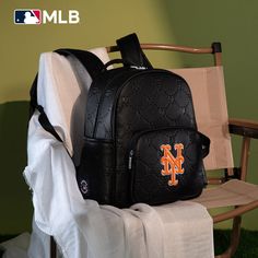 Made of synthetic leather NY logo is prominently embroidered on the front pocket. Top zipper closure Includes a spacious main compartment and a front zippered pocket for easy access to essentials. Side pockets provide additional storage options A zippered pocket on the back Adjustable padded shoulder straps 13.2"(L) x 6.5"(W) x 13"(H) Interior Capacity: Large Black Logo Bags For Outdoor Activities, Sports Bags With Zipper Closure, Black Sports Bags With Letter Print, Black Sports Bag With Letter Print, Embroidered Logo Travel Bags For Back To School, Black Sports Backpack With Zipper Closure, Travel Bags With Embroidered Logo For Back To School, Back To School Travel Bags With Embroidered Logo, Functional Backpack With Logo For Everyday Use