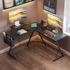 a computer desk with two monitors on it