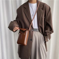 A must-have style for daily adventures, our vertical crossbody mini box bag goes with everything. Whether you're slipping into a two-piece or an oversized cardigan, this bag defines your outfit with its unique silhouette made from rigid PU leather.
Gender: UnisexMaterial: PU LeatherSize: Mini (18.5 x 13 x 5 cm)Type: Messenger / CrossbodyClosure: Magnetic Buckle Trendy Business Crossbody Box Bag, Rectangular Shoulder Bag For Work With Cell Phone Pocket, Rectangular Shoulder Bag With Cell Phone Pocket For Work, Modern Shoulder Bag With Mobile Phone Pocket For Work, Fall Everyday Mobile Phone Box Bag, Fall Mobile Phone Box Bag For Everyday Use, Brown Shoulder Bag For Work With Cell Phone Pocket, Brown Workwear Shoulder Bag With Cell Phone Pocket, Trendy Rectangular Phone Bag For Business