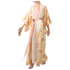 Vintage Japanese kimono in 100% silk  Handmade in Japan Floor length Pale peach with coloured print Comes with a blush pink silk ribbon that gives you the option to wear this open or closed  FREE SHIPPING WORLDWIDE!!! Composition: 100% Silk Size: ONE SIZE  - Will fit a XS - L depending on how oversized you desire the fit  Some small faint marks to the body and lining that are shown in detail in the photographs - Please note that these get lost amongst the print and are barely visible when worn. Pink Silk Ribbon, Informal Dress, Over Coat, Kimono Vintage, Designer Coats, 18th Century Fashion, Pale Peach, Vintage Japanese Kimono, Dolce Gabbana Dress