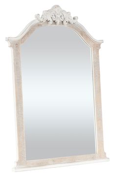 a large white mirror sitting on top of a table