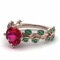 a red ring with green stones and leaves on the side, set in gold plated silver