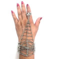 "Be your a Dreamweaver with this enchanting silver-tone spider web finger bracelet. A delicate and intricate spider web chain fits over one finger, then a detailed cuff securely clasps around the wrist. With a whimsical and intricate design, this spiderweb finger bracelet will embellish your festive style- it's Ideal for Halloween, but it can be worn year-round by nature lovers. This fun women's spider web bracelet makes a great addition to your jewelry collection- you'll love our spider finger Adjustable Alloy Bracelets For Festival, Festival Alloy Bracelet Jewelry, Elegant Festival Alloy Bracelets, Bohemian Alloy Bangle Jewelry, Adjustable Alloy Body Jewelry For Parties, Gothic Metal Chain Body Jewelry, Bohemian Alloy Bangle, Adjustable Silver Chain Bracelet In Alloy, Adjustable Metal Jewelry For Parties