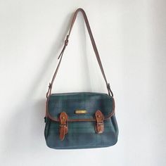 This vintage Polo Ralph Lauren book bag satchel is a stylish accessory for any unisex adult.  The coated canvas material gives it a durable and waterproof quality, while the green and blue plaid pattern adds a touch of class to any outfit. The spacious interior makes it perfect for carrying books, folders, and other essentials.  It's a must-have for any fan of Polo Ralph Lauren or anyone looking for a fashionable and functional bag. Width: 13" Height: 10" Ralph Lauren Tote, Blue Plaid Pattern, City Boy, Vintage Polo Ralph Lauren, Dream Style, Vintage Polo, Book Bag, Blue Plaid, Stylish Accessories