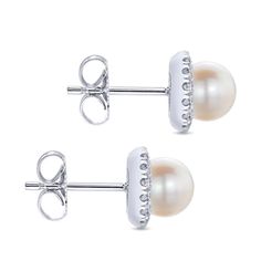 Designer Gabriel's masterfully crafted pearl stud earrings feature luminous round pearls accented by shimmering 0.22 carat diamond halos for a sophisticated and timeless addition to any jewelry collection. Elevate your style with these must-have earrings. Available in 14K or 18K white, rose or yellow gold Includes earring box Includes jewelry appraisal Ships fully insured to point of delivery Luxury White Cluster Earrings With Diamond Accents, Luxury White Cluster Earrings For Anniversary, White Cluster Earrings For Formal Occasions, White Luxury Cluster Earrings With Prong Setting, Luxury White Cluster Earrings With Prong Setting, White Round Cluster Earrings For Formal Occasions, Elegant White Round Cluster Earrings, Formal White Brilliant Cut Earrings, Luxury White Cluster Earrings With Halo Design