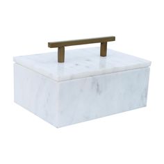 a white marble box with a wooden handle