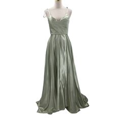 a green dress on a mannequin dummy