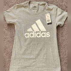 Women's Adidas T-Shirt Size M Affordable Adidas Logo Athleisure T-shirt, Cheap Adidas Tops With Logo Print, Gray Logo Print T-shirt For Spring, Basic Adidas T-shirt With Graphic Print, Basic Adidas Tops With Logo Print, Adidas Logo Print T-shirt For Spring, Adidas Spring T-shirt With Logo Print, Adidas Graphic Tee T-shirt For Spring, Adidas Graphic Tee For Spring