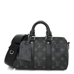 This is an authentic LOUIS VUITTON Reverse Monogram Eclipse Keepall Bandouliere 25. This chic shoulder bag is crafted of Louis Vuitton monogram canvas in black with gray on the sides. The bag features a black nylon shoulder strap with silver hardware. The top zipper opens to a black fabric interior with a pocket. Louis Vuitton Black Bag, Black Louis Vuitton Bag, Weekend Bags, Louis Vuitton Travel, Louis Vuitton Keepall, Louis Vuitton Shoulder Bag, Louis Vuitton Damier Ebene, Vuitton Bag, Black Nylon