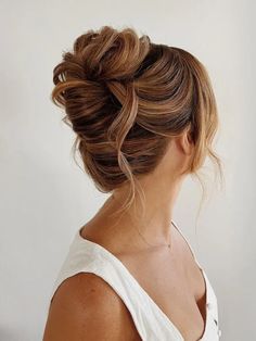 Soft French twist wedding updo for long hair Low Bun Wedding Hair Brunette Messy Updo, Messy Updo For Wedding, Loose Chignon Updo, Loose High Updo Wedding, Tousled High Bun, High Messy Bridal Updo, Updo Hair Wedding Guest, Hair Updos Elegant, Wedding Reception Updo