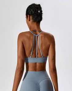 Haze Blue Yoga Activewear With 4-way Stretch And Straps, 4-way Stretch Sports Bra With Straps For Gym, Sports Bra With Straps For Workout, Gym Sports Bra With 4-way Stretch Straps, Moisture-wicking Stretch Sports Bra With Strappy Design, High Stretch Strappy Activewear For Sports, Sports Bra With 4-way Stretch And Strappy Back, Nylon Yoga Activewear With Straps, Sporty 4-way Stretch Activewear With Straps