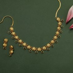 Description: Adorned with bright green stones and traditional coin motifs, this antique gold-plated necklace is a classic and versatile piece. Perfect for your special occasions, its timeless design combines fine craftsmanship with elegant style, making it a standout accessory for traditional outfit. Details & Specification: Materials used: Brass Alloy with Antique Gold Plating Weight - Necklace- 29 gm, Earrings- 6.5 gm Length - Necklace-11cm, Earrings-3 cm Make it custom: Want to make it a cust Kempu Necklace, Traditional Outfit, Antique Green, Choker Pendant, Green Stones, Length Necklace, Kundan Earrings, Kids Necklace, Cz Earrings