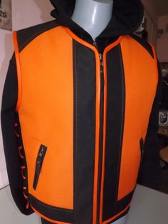 Biker vest.Textile: orange with black.Orange leather finish. Two external pockets and two inside pockets. Camouflage textile+ genuine leather. I will make vests from S.. to 5X size. The customer can change the style of the vest according to his taste. Leather braid, accessories (clips, zippers, pockets, everything can be changed). Made by designer and leather tailor with experience of 30 years. There can be produced in any size and model take 4-6 days. Order can be any size from S to 5X. The lea Winter Orange Sleeveless Vest, Orange Sleeveless Winter Vest, Sleeveless Sweaters, Braid Accessories, Sweater Vest Mens, Biker Vest, Sleeveless Jumper, Leather Finish, Biker Leather