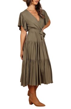 Whether you're off to brunch or your next day date, this versatile wrap-style dress with fluttery short sleeves can do it all. Slips on over head Surplice V-neck Short sleeves Elastic waist Removable sash Unlined 100% rayon Hand wash, line dry Imported Flowy Faux Wrap Dress For Spring, Flowy Wrap Dress For Brunch, Solid Maxi Dress With Tie Waist And Short Sleeves, Flutter Sleeve Midi Dress For Brunch, Flowy Wrap Dress With Surplice Neckline For Brunch, Short Sleeve Wrap Dress With Tie Waist For Brunch, Short Sleeve Midi Dress With Tie Waist For Brunch, Solid Color Midi Dress With Flutter Sleeves For Brunch, Flowy Wrap Dress With Flutter Sleeves And Ruffles