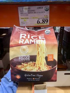 a bag of rice ramen is sitting on a shelf in a store for sale