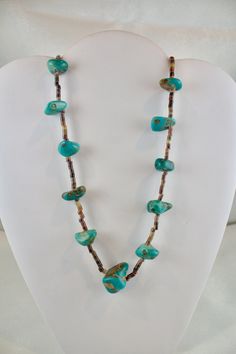 Vintage c1940's-1950's Navajo Heishi necklace Turquoise and Oyster Shell beads The turquoise appears to be natural and not color enhanced graduated stones 3/8" to 1 inch in size  measures 30 inches long strung on a cotton thread  very good condition Turquoise Single Strand Southwestern Jewelry, Collectible Turquoise Necklaces With Natural Stones, Turquoise Natural Stones Necklace For Collectors, Southwestern Untreated Turquoise Necklace, Vintage Turquoise Necklace Hand-strung, Untreated Southwestern Turquoise Necklace, Vintage Hand-strung Turquoise Necklace, Vintage Turquoise Gemstone Beads Jewelry, Vintage Turquoise Single Strand Necklace