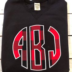 I’m loving this Buffalo plaid monogram!!#buffaloplaid Varsity T-shirt With Embroidered Graphics For Fall, Fall Varsity T-shirt With Logo Print, Fall Cotton Tops With Monogram, Monogram Cotton Tops For Fall, Black School Spirit Sweatshirt With Crew Neck, Fall T-shirt With Embroidered Graphics For School Spirit, Embroidered Fall College T-shirt, Fall Varsity T-shirt With Embroidered Graphics, Fall Fleece Tops With Logo Print